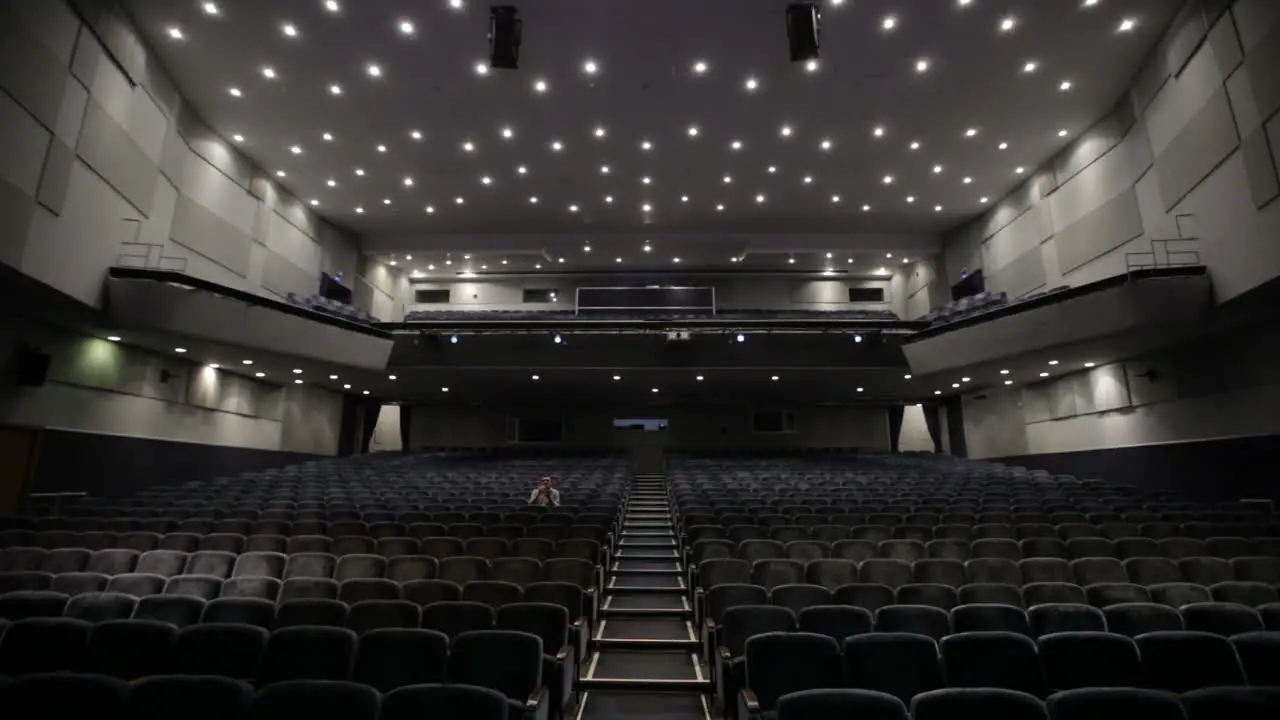 Man applauds alone in the theater