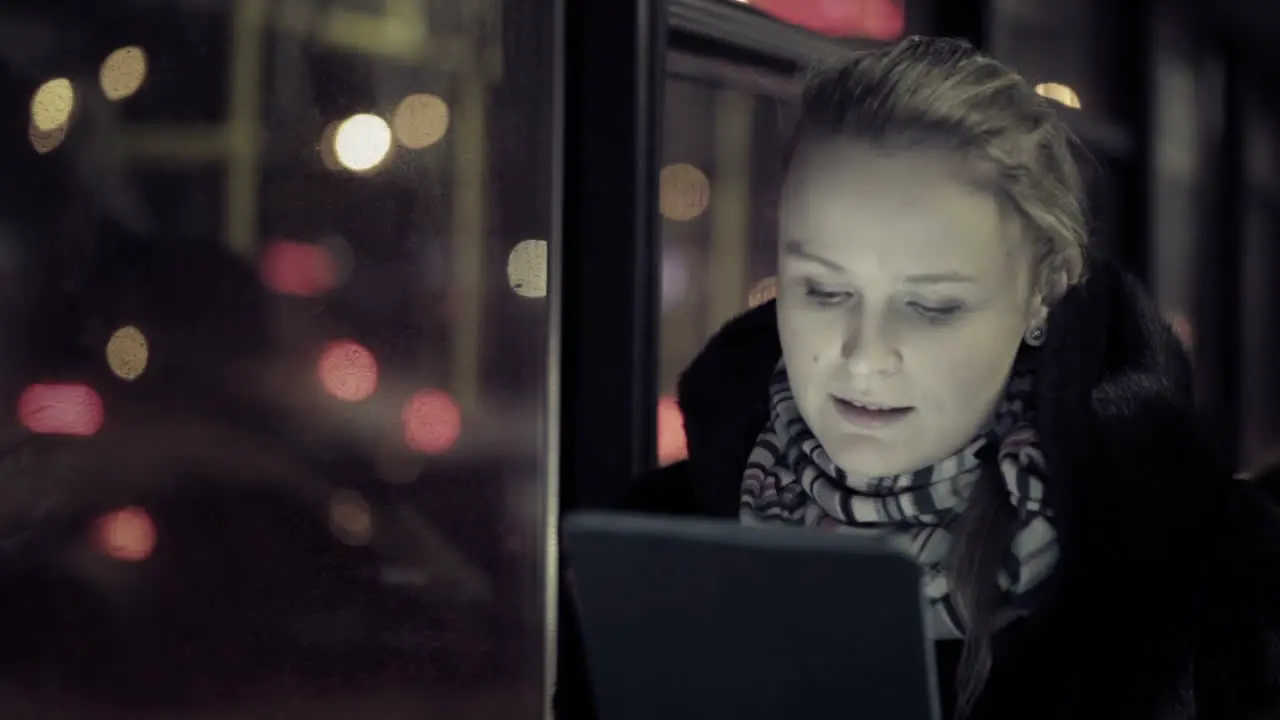 Woman with touchpad in the bus