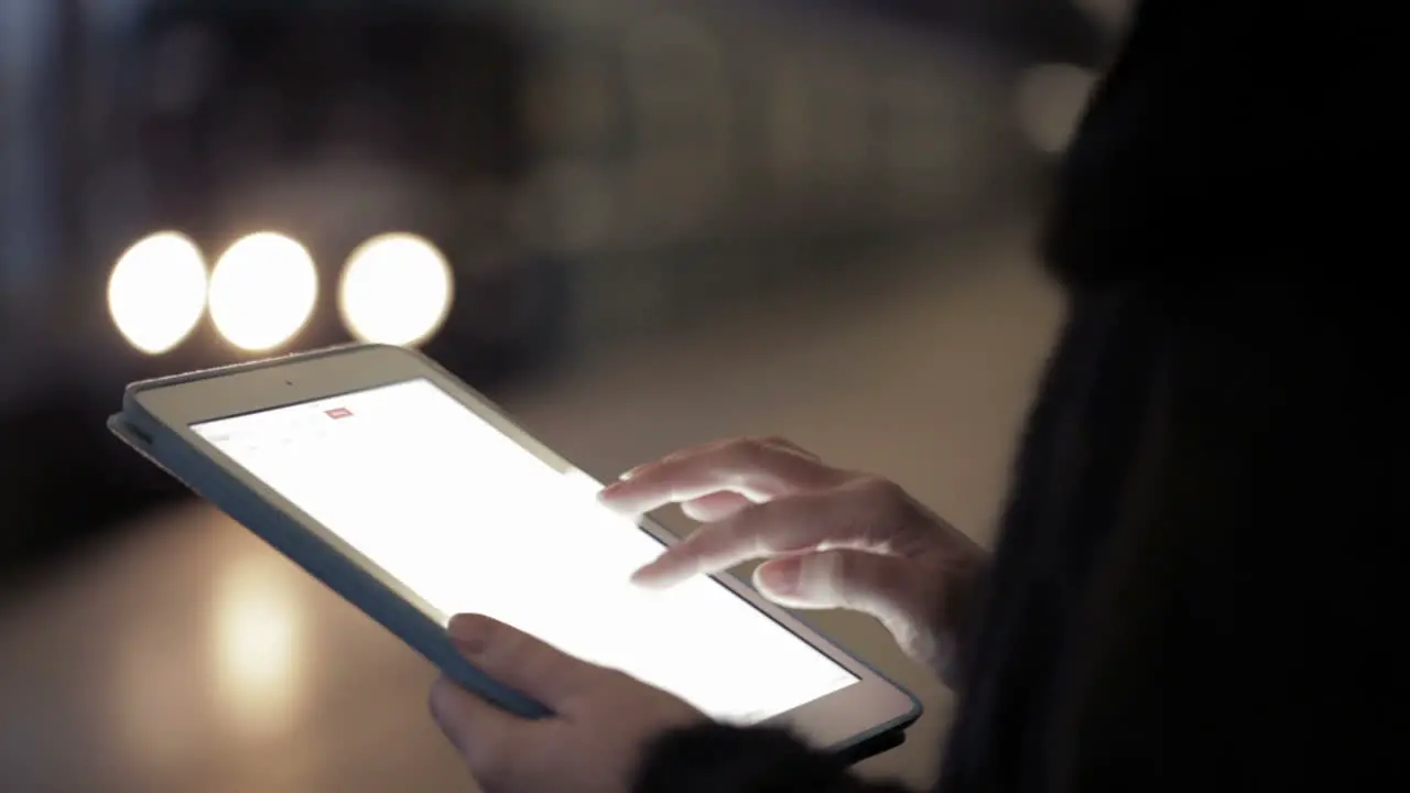 Woman using touchpad in the underground