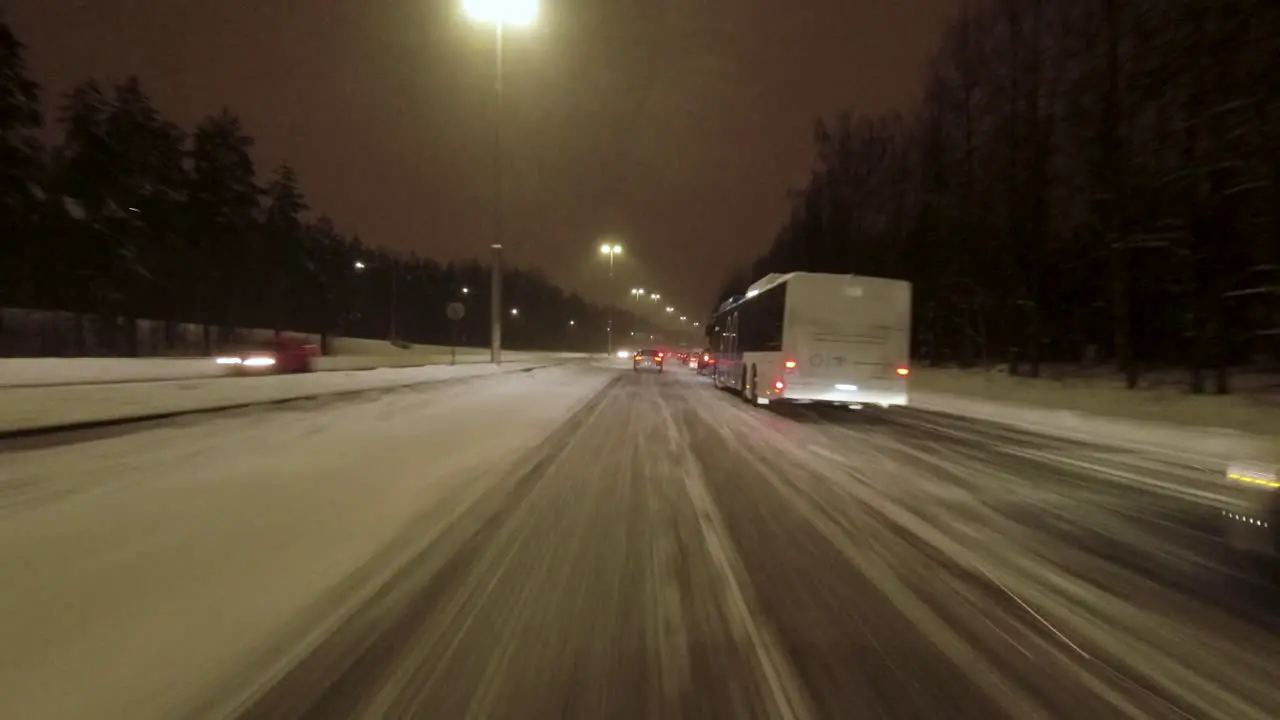 POV shot driving in heavy traffic in Helsinki after a heavy snowfall