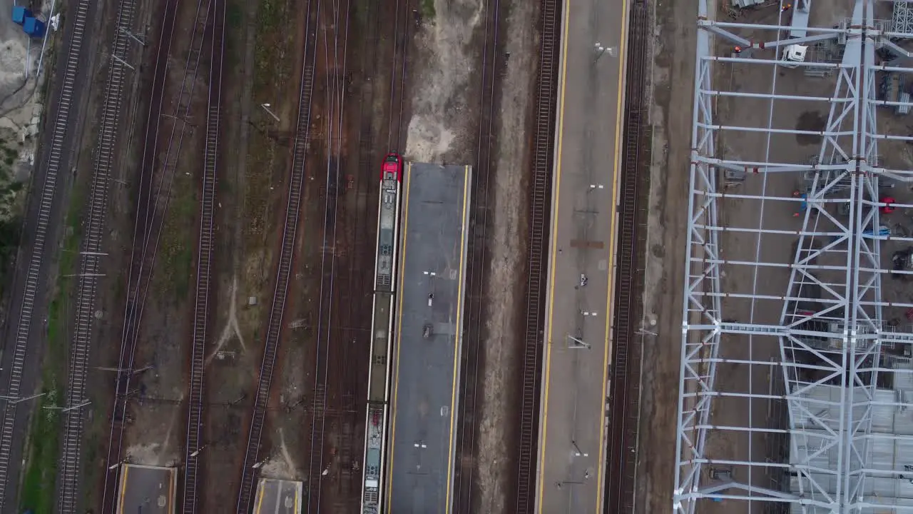 A drone video of passenger trains moving at a train station in Warsaw Poland