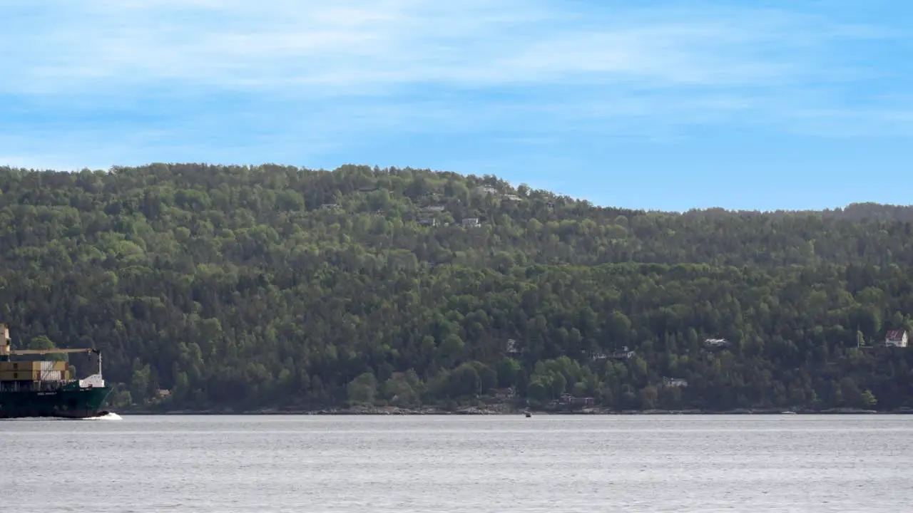 Container ship MSC Anne F sailing out of the Oslo fjord on a sunny summer day loaded with containers