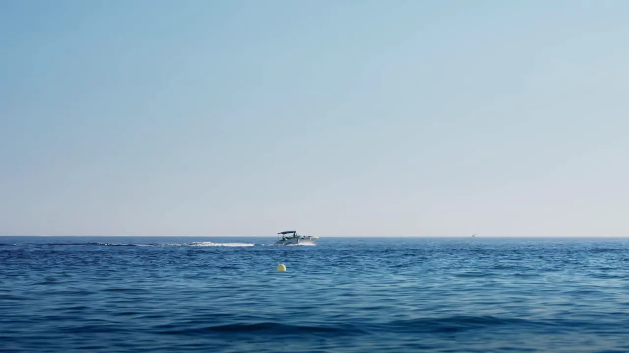 Speedboat in slow motion with a clear blue sky