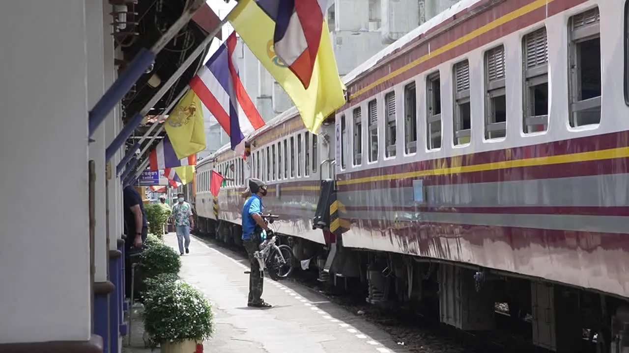 Tourists getting out of the train and others hop on