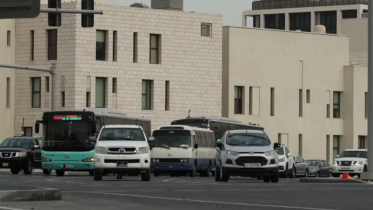 View of Karwa Public transportation buses arriving after traffic signal opens