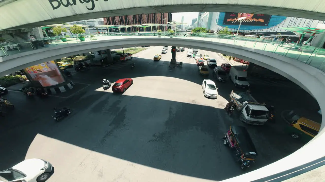 wide view of cars bustling through the heart of Bangkok