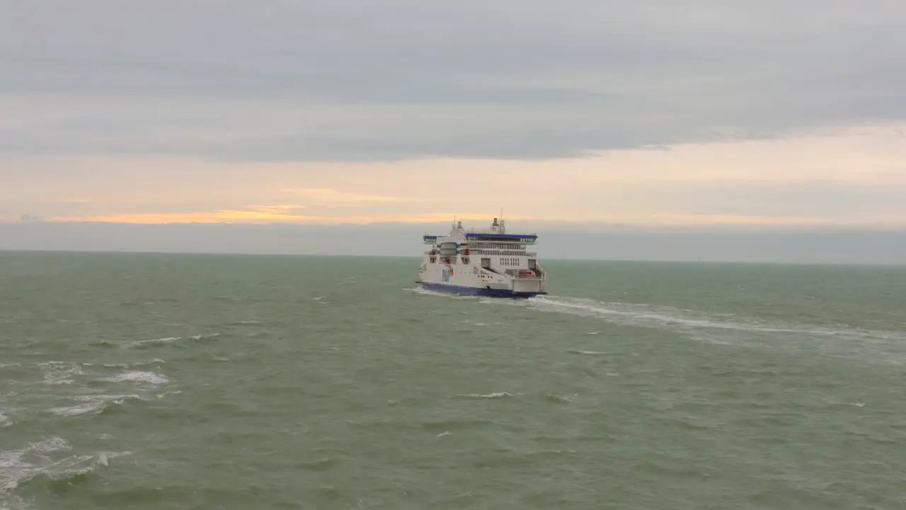 Ferry crossing choppy waters of English Channel at sunset