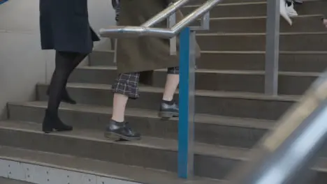 Close Up Of Commuters Climbing Stairs At London UK Rail Station 1