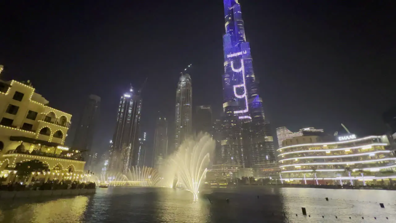 Dubai fountain water show seen in a wide scene near the Burj Khalifa light show