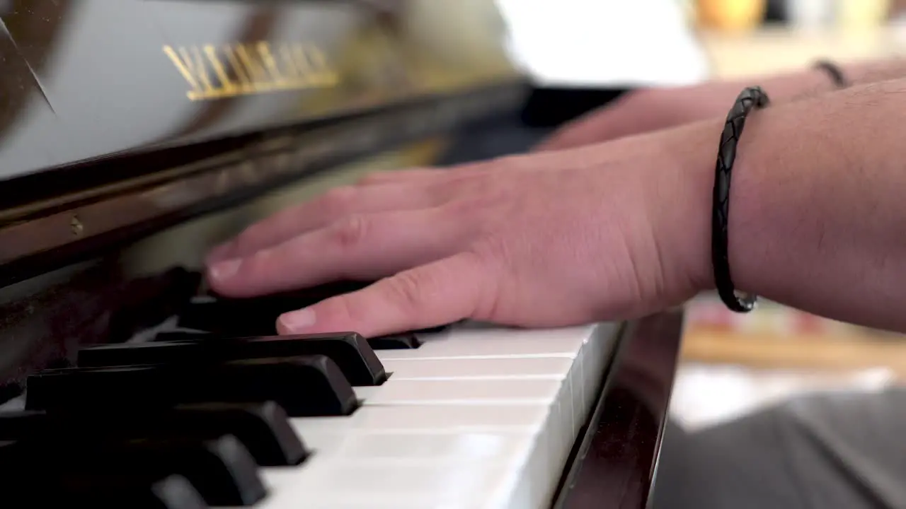 Close up of whit caucasian hands playing piano quickly and expertly