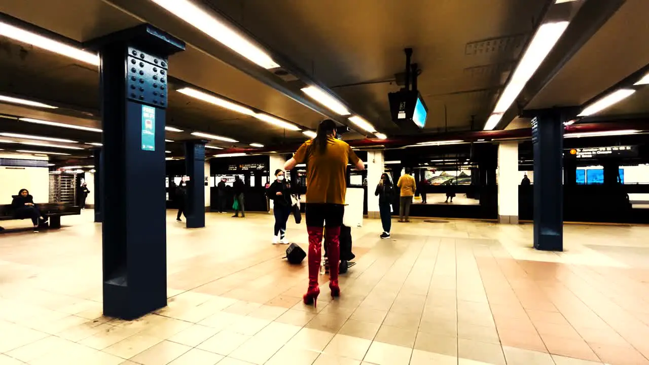 Talented singer performing on the streets of New York singing on the platform of New Yorks subway system