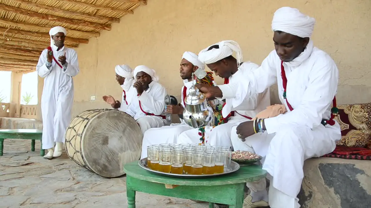 Group of Berbere´s playing tradicional music and instruments while serving tea