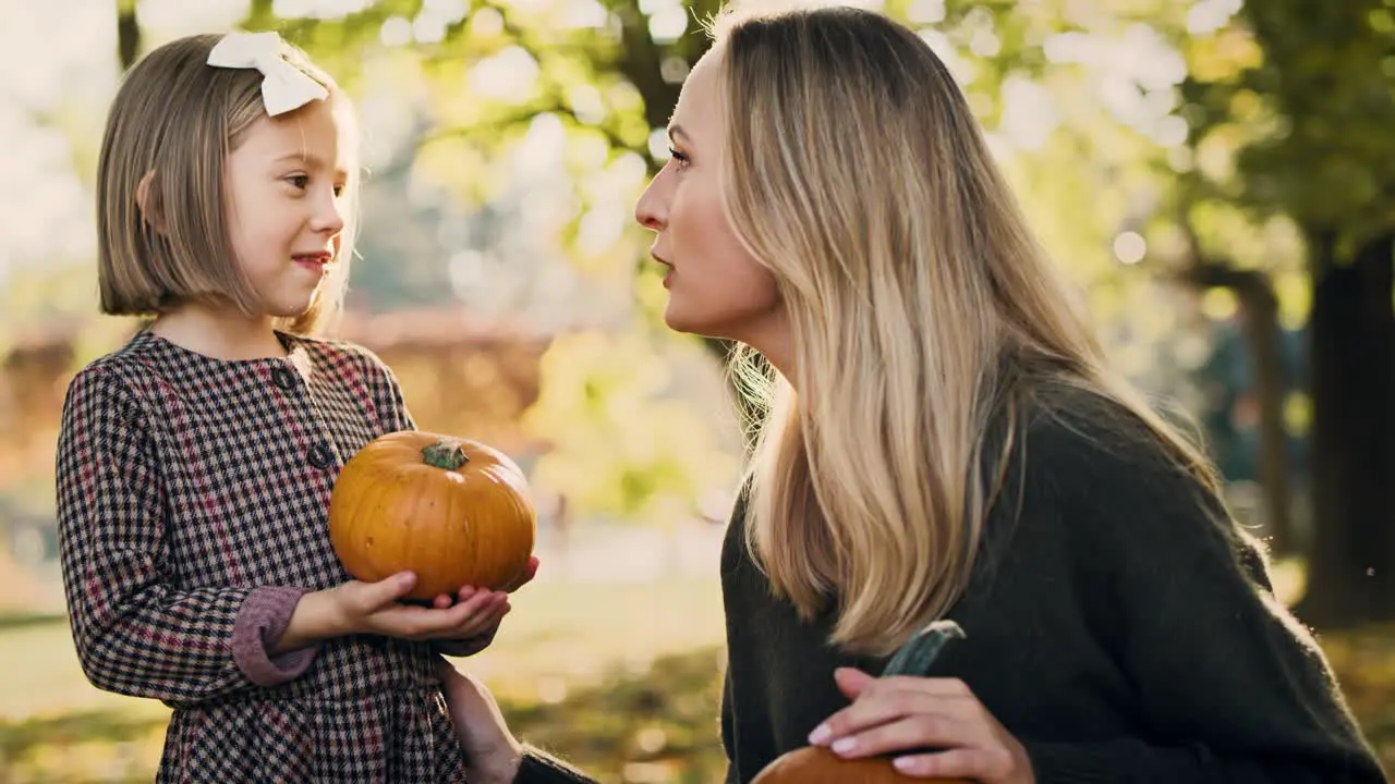 Handheld view of smiley mother with daughter