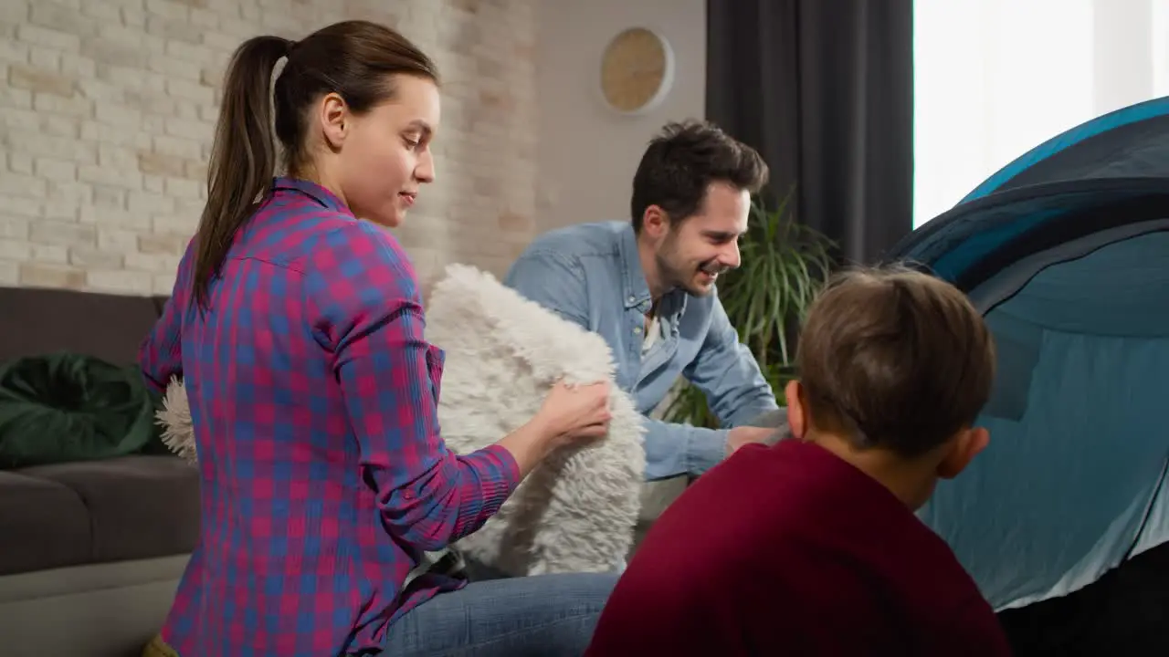 Video of family with boy preparing tent at home