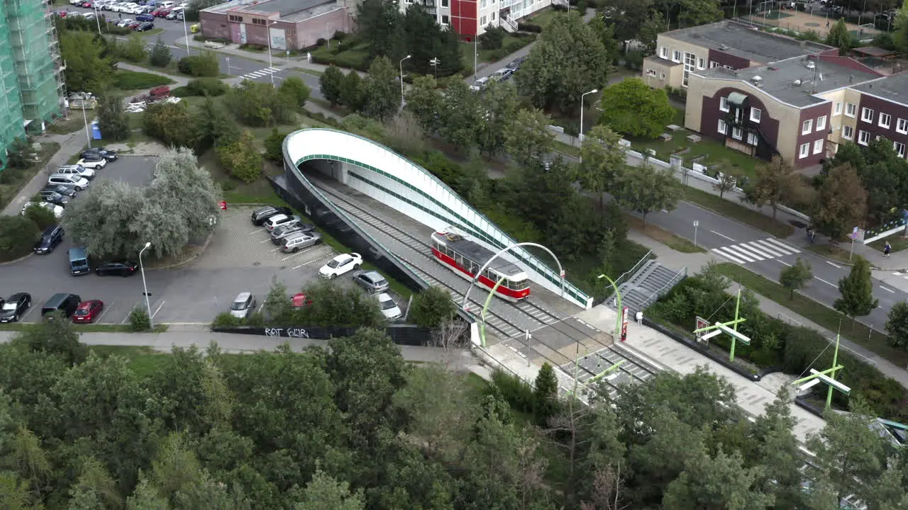 Aerial Shot Of A Tram Entering A Underground Station In Prague City Public Transportation