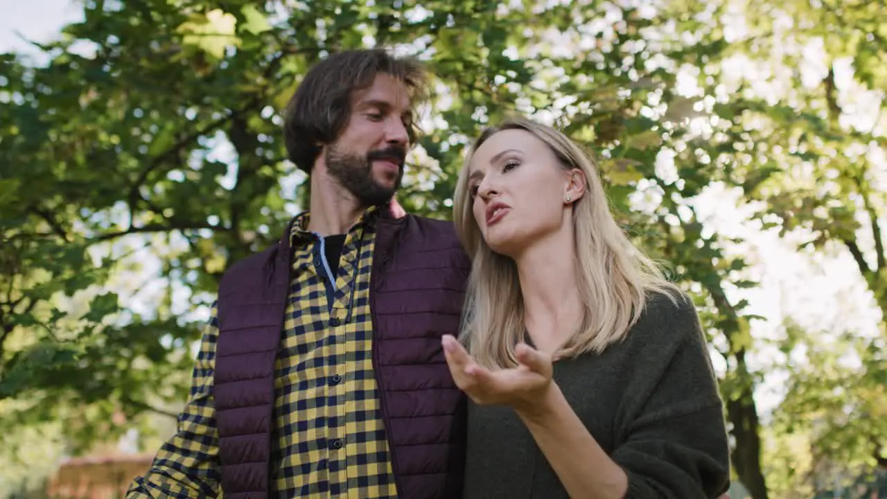 Low angle view of affectionate couple during autumn walk