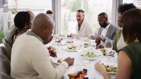 Diverse group of friends eating food