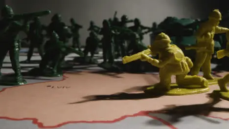 Tracking Shot of Toy Soldiers On Map of Ukraine 10