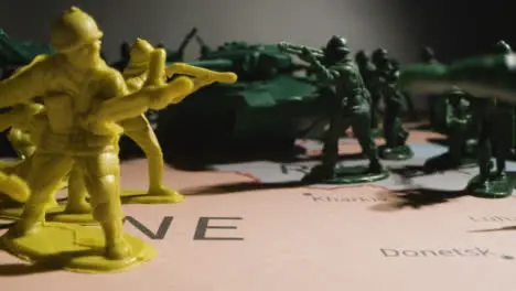 Tracking Shot of Toy Soldiers On Map of Ukraine 11