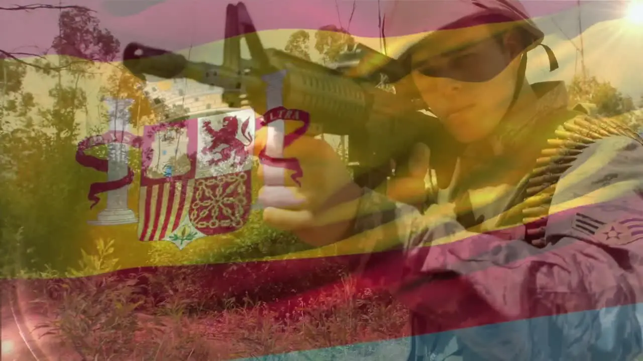 Animation of flag of spain over caucasian male soldier with weapon