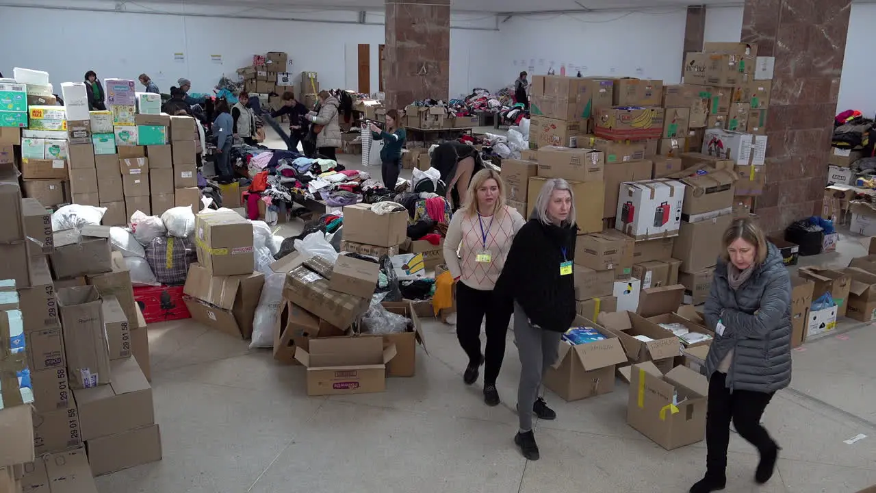 Volunteers sort through boxes of donated clothing in the Art Palace of Lviv that has been converted into the largest aid centre in the region during the Russian war against Ukraine