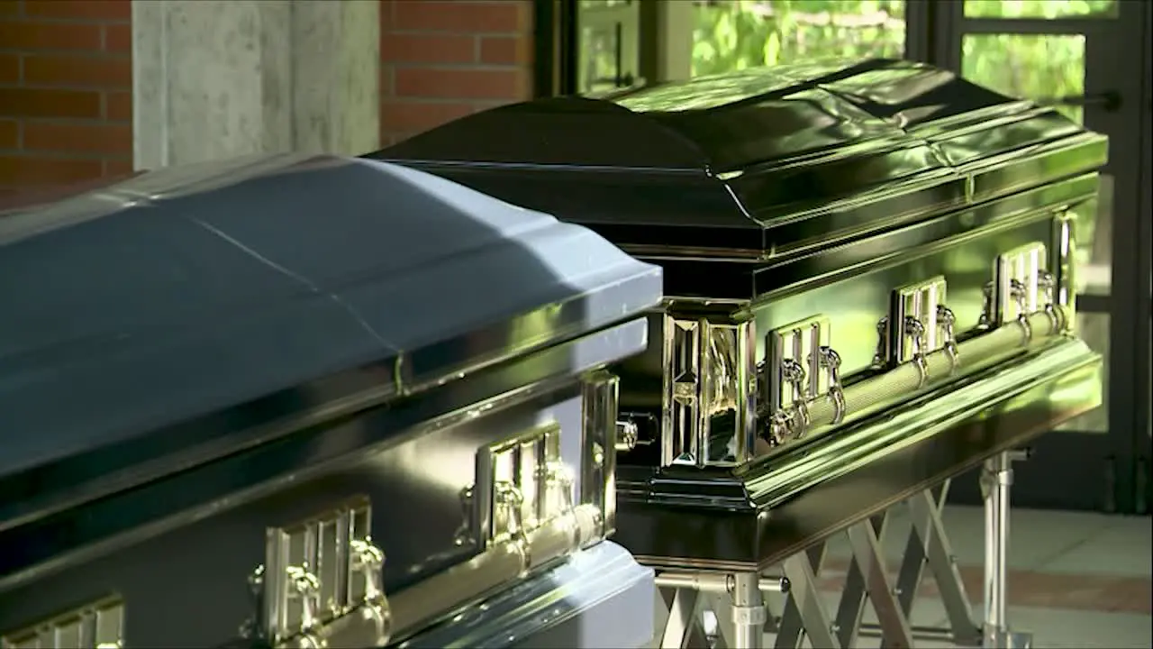 TWO COFFINS SIDE BY SIDE