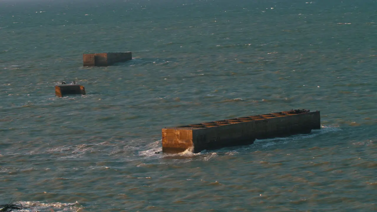 View of World War II phoenix blocks  artificial Mulberry harbours  Normandy landings in June 6 1944 D-Day Pointe du Hoc Arromanches