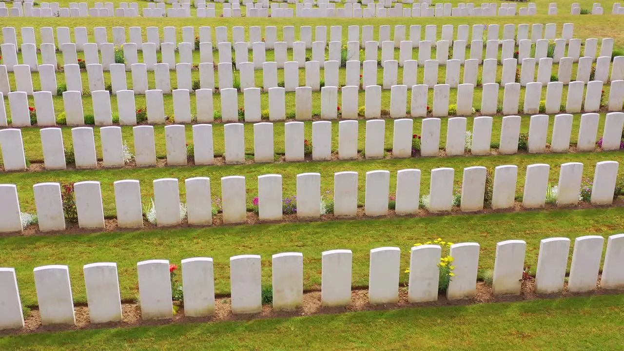 Aerial over headstones of the Etaples France World War cemetery military graveyard and headstones of soldiers 2