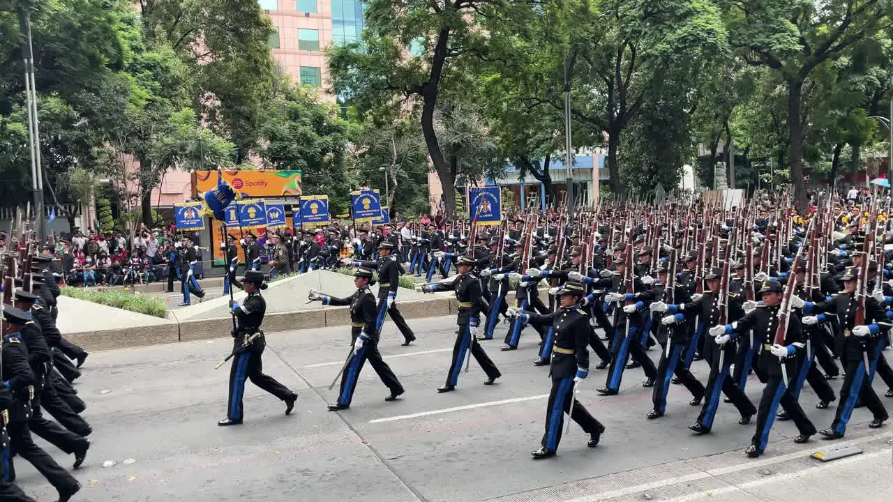 slow motion shot of the body of swordsmen of the mexican army during parade