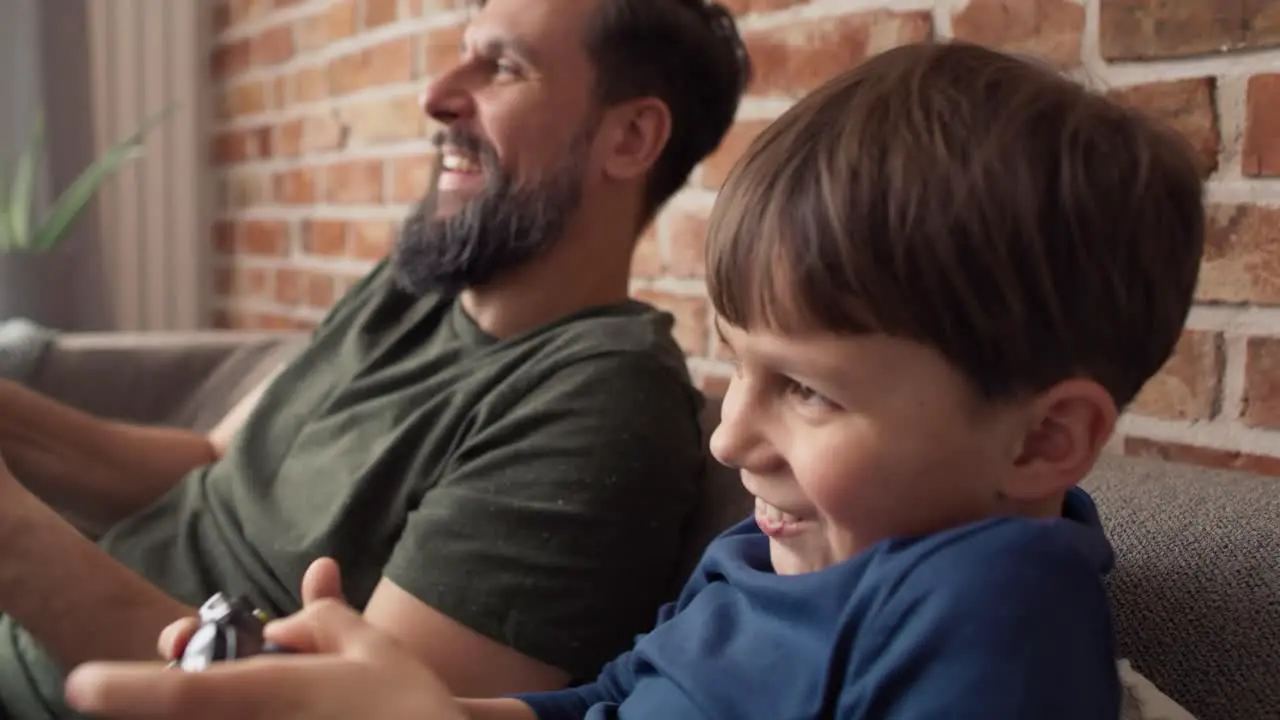 Video of father and son having fun during playing game