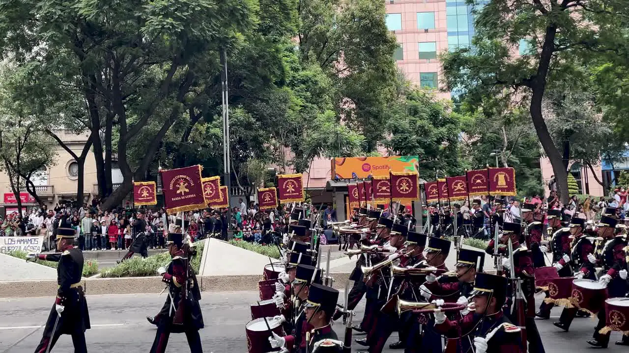 slow motion shot of the symphony of the mexican army during the military parade in the avenue of the paseo de la reforma in mexico city