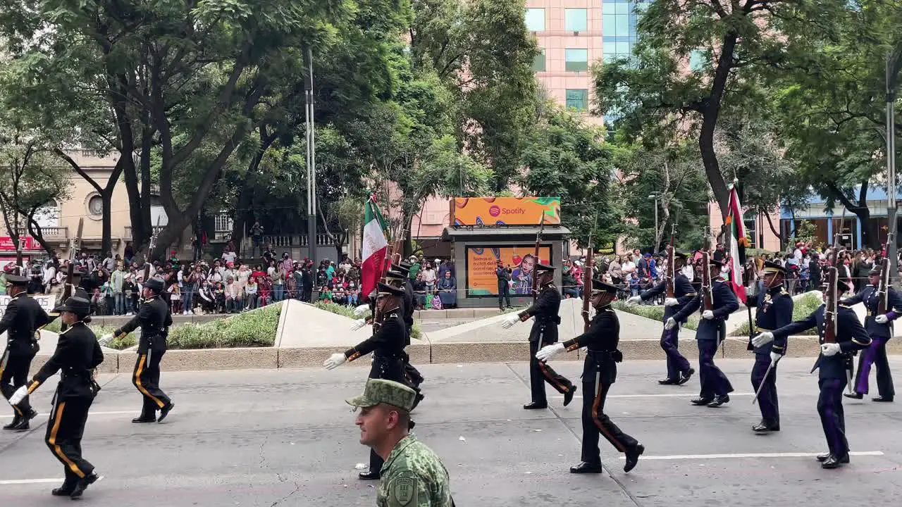 slow motion shot of the mexican army expeditionary corps during the military parade on the paseo de la reforma avenue in mexico city