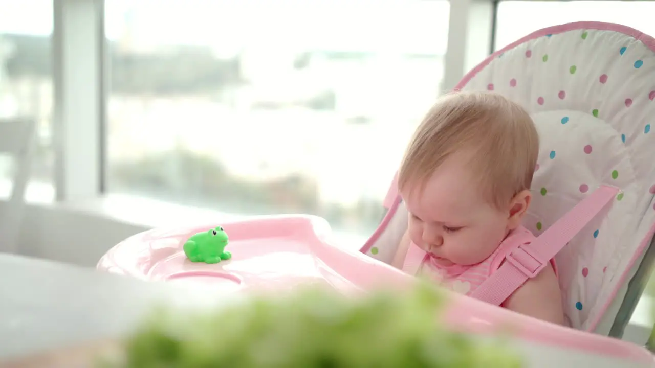 Beauty baby girl eating apple Toddler missed food from hand Baby fruit eating