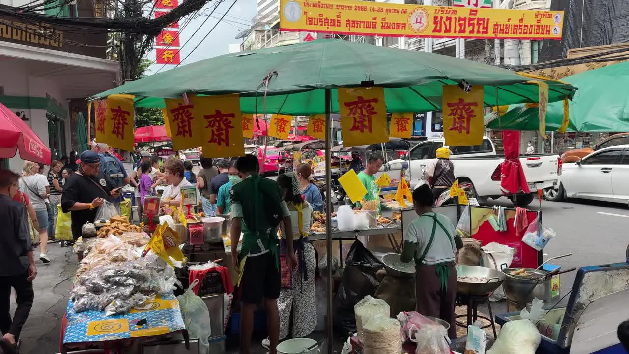 Scene of street food vendors are busy selling food for tourists during one of Thailand's most unique events the Vegetarian Festival in Yaowarat Chinatown Bangkok Thailand