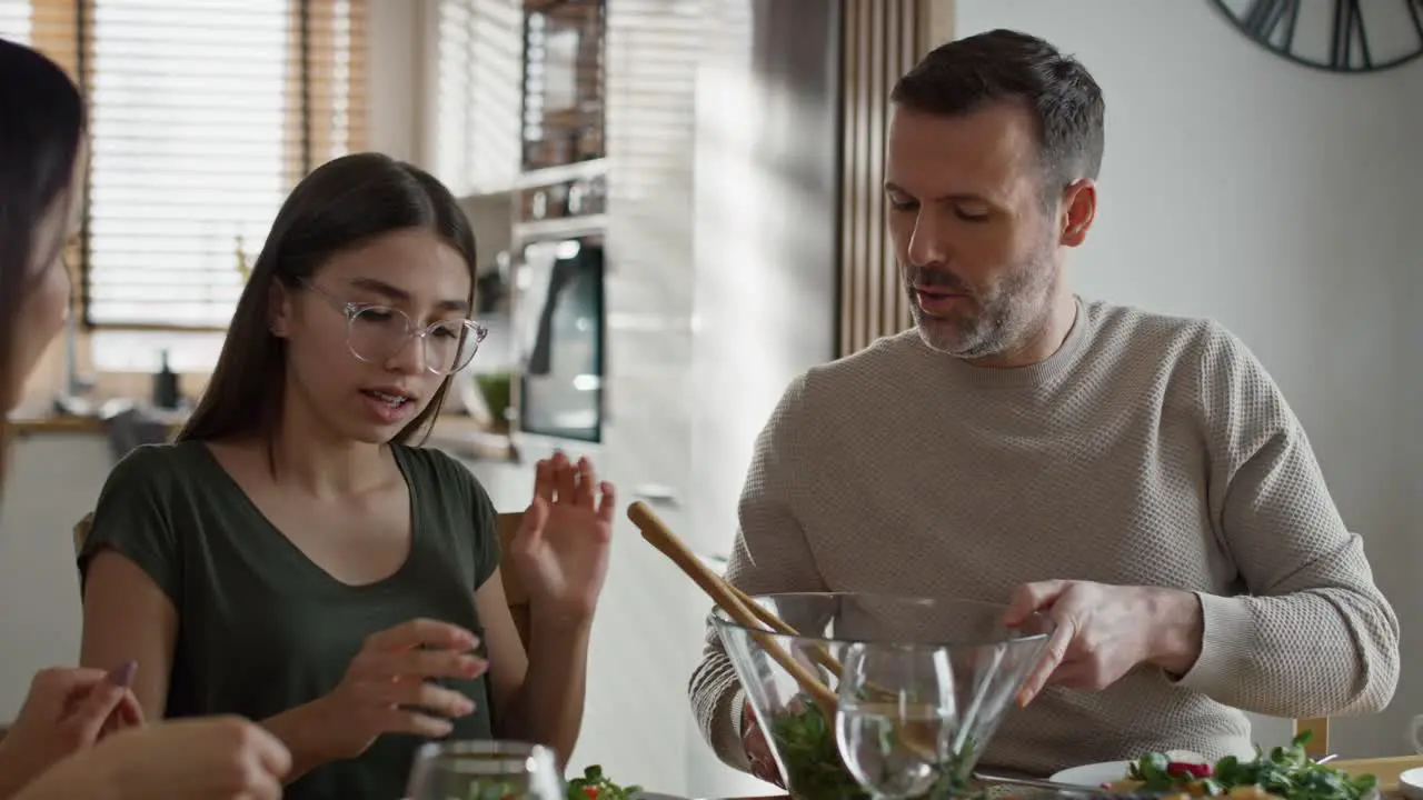 Caucasian family having a vivid conversation during the breakfast