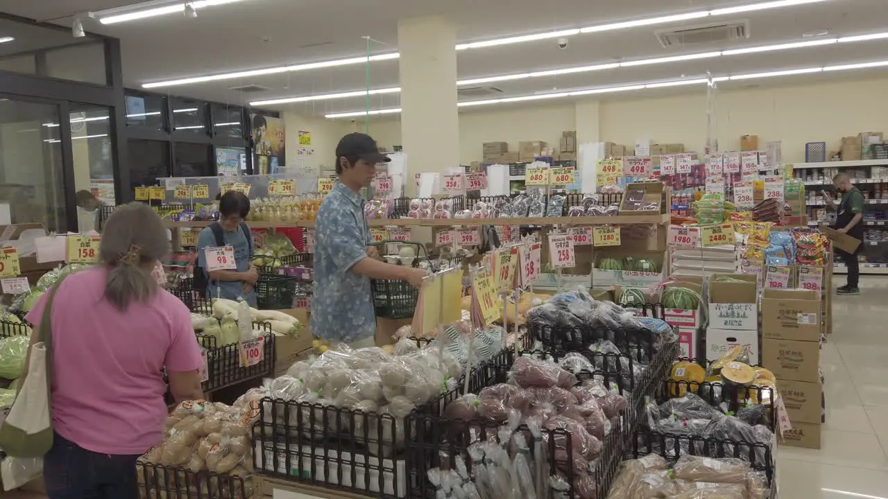 Japanese People Buy Groceries Inside a Local Supermarket in Kyoto Pale Colors Shot