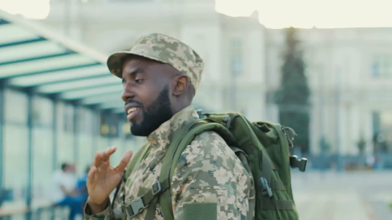 Handsome Soldier Saying Goodbye And Blowing Kisses To His Girlfriend