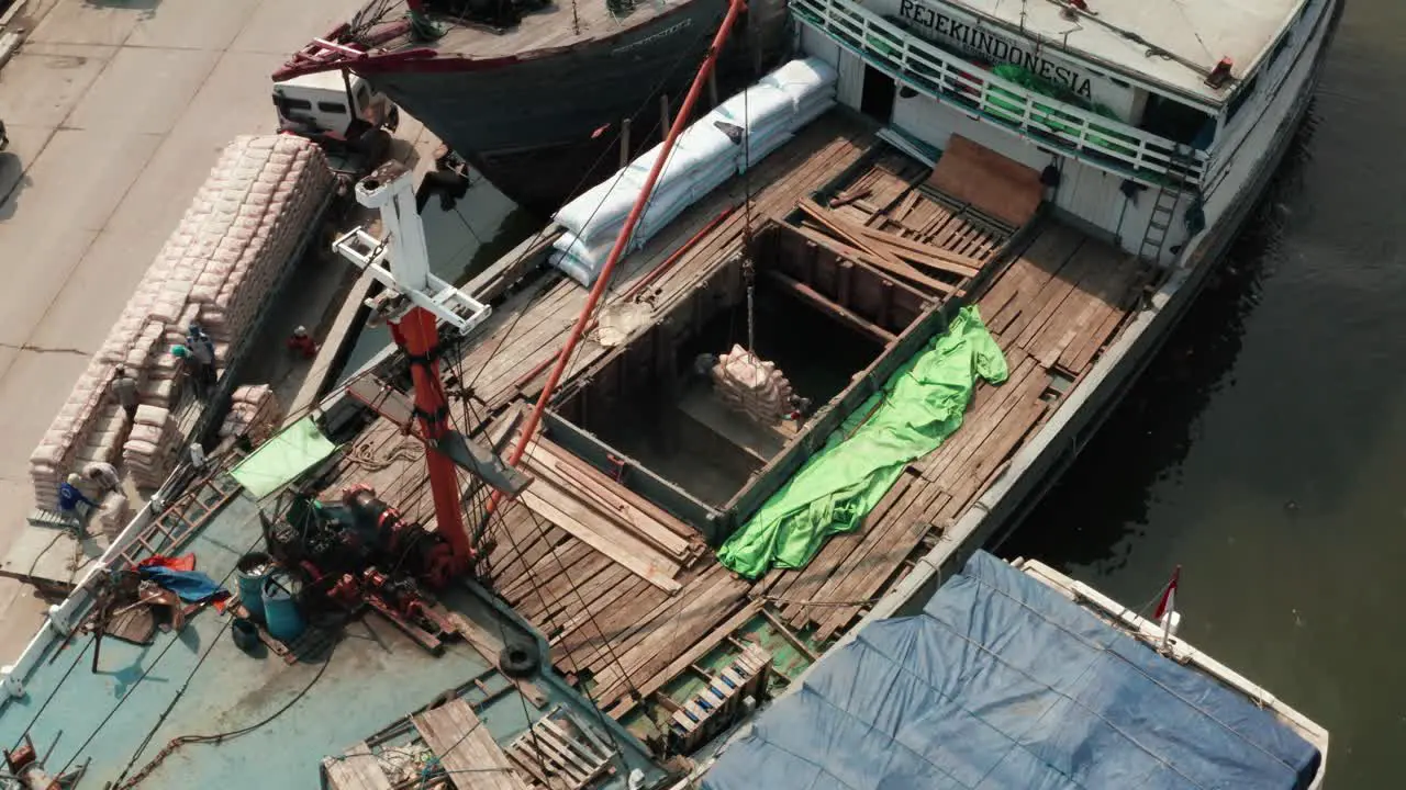 Rotating Drone Shot of Boats Loaded in Jakarta