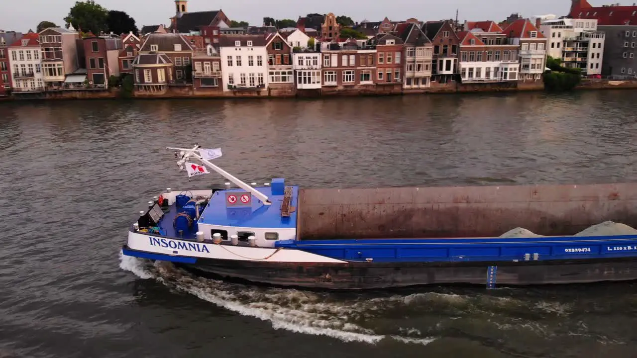 Aerial shot of sand cargo ship in dutch canal