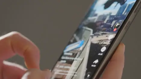 Close Up of Finger Scrolling on Tik Tok on a Phone