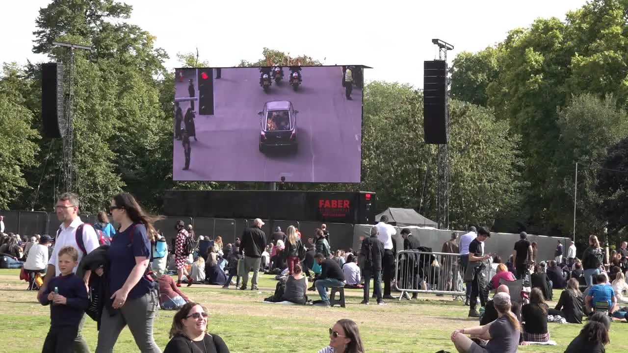 Thousands gather to mourn the passing of the Queen and watch the funeral on big screens in Hyde Park central London UK