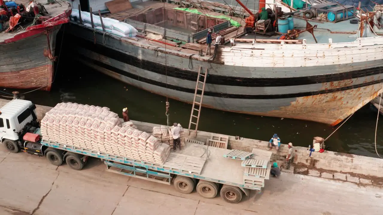 Drone Shot of Men Working on Boats in Jakarta