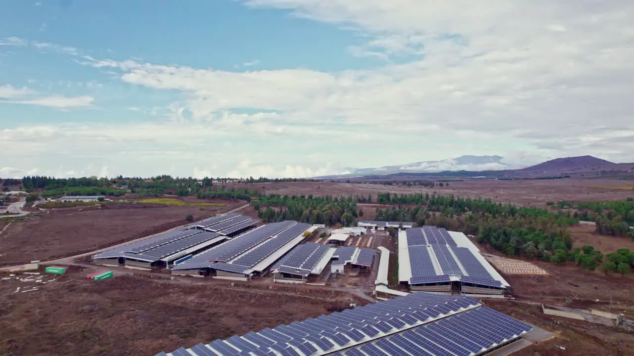 Drone shot of solar panels in a rural area