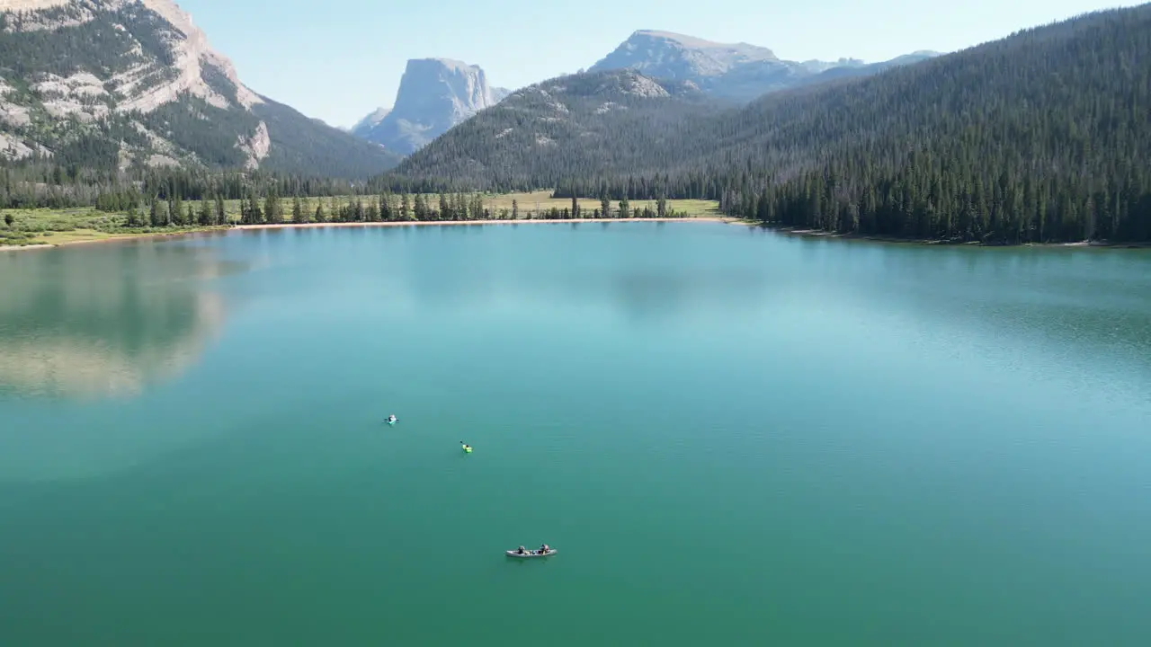 Idyllic Scenery Of Green River Lakes With Kayakers On The Water In Wyoming USA aerial drone shot