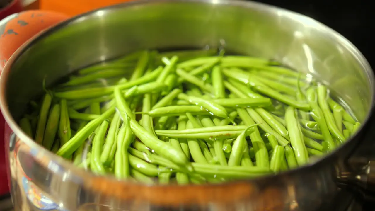 Fresh Green Beans in water in a cooking pot