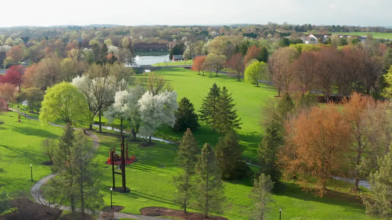 Beautiful aerial of walking trail path through park in full bloom during spring season