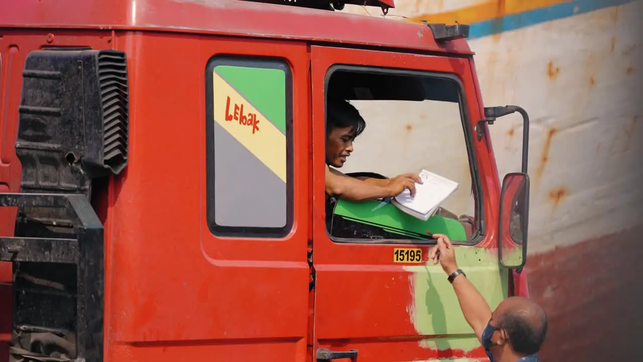 Mid Shot of Man Getting into Van