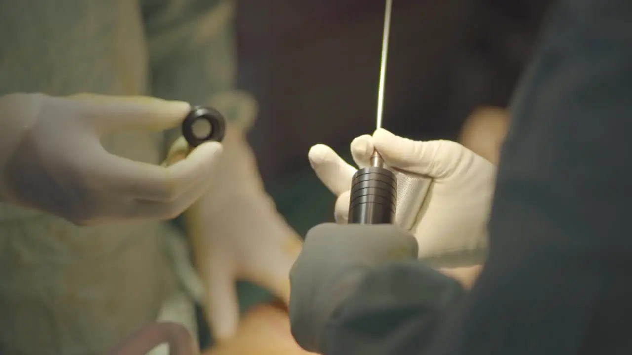 Plastic surgeon manipulating a suction catheter