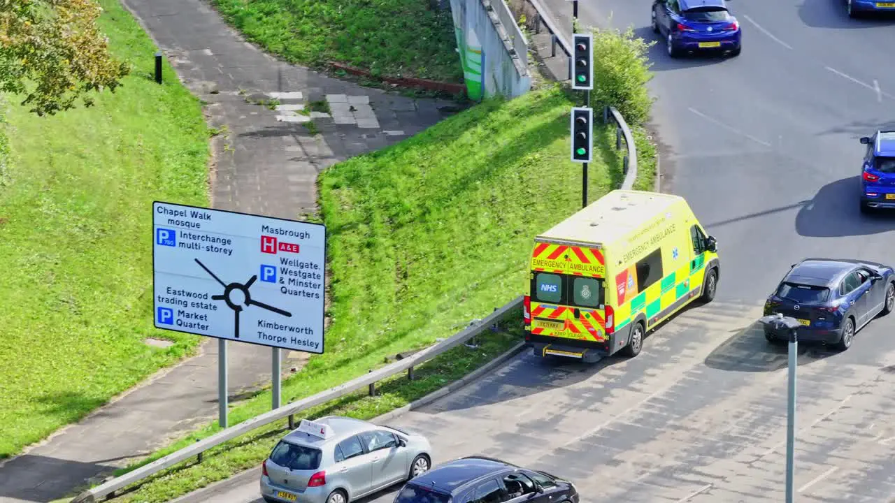 Aerial View Of Ambulance And Cars Driving In The Road In Rotherham England