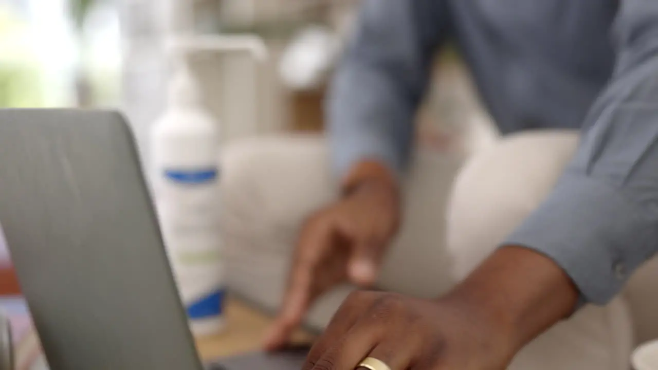 Sanitizer laptop and person hands cleaning